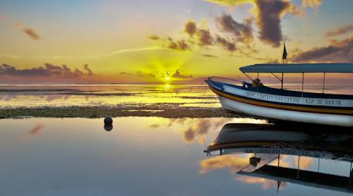 Sunset from Sanur beach on Bali, Indonesia.